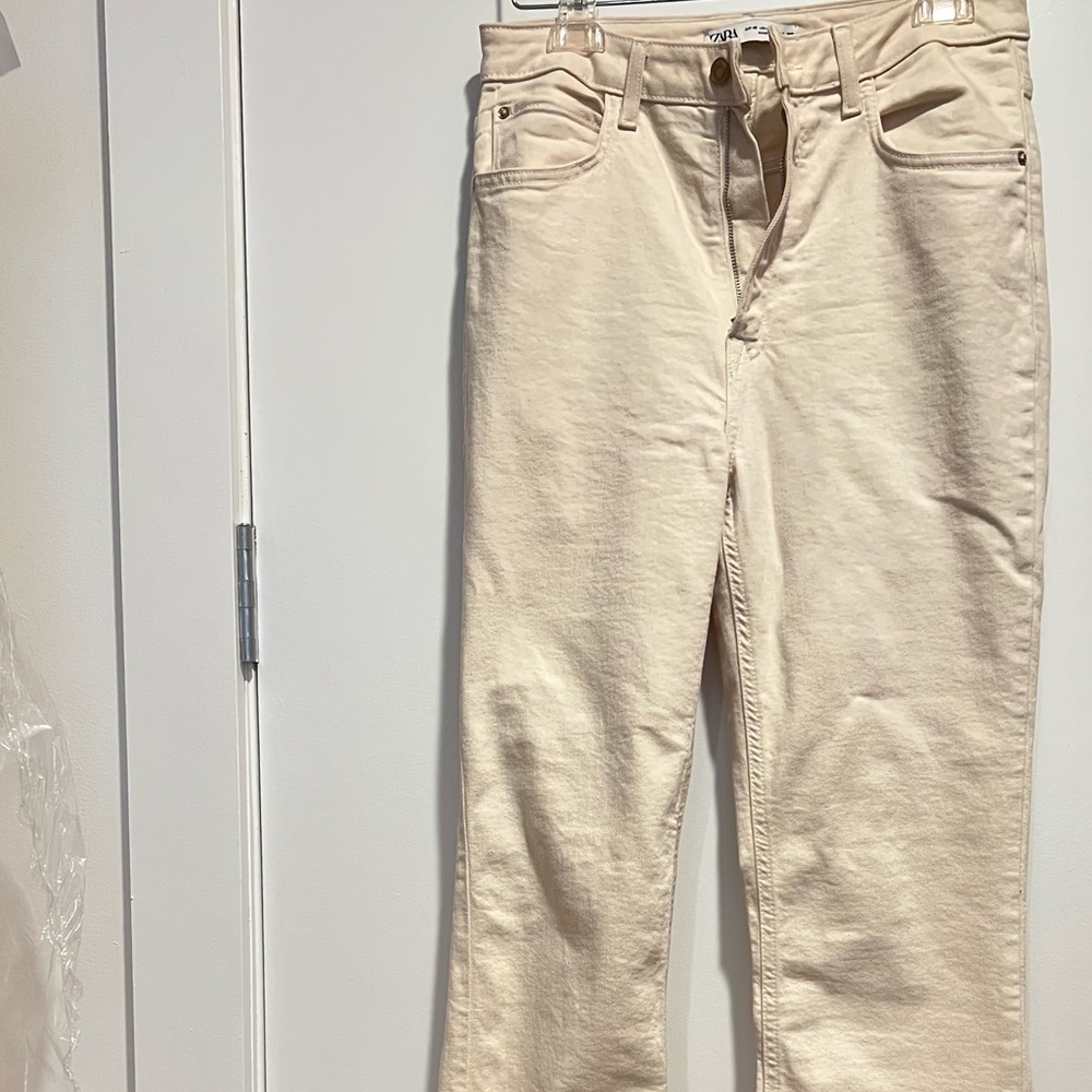 SLIM FLARED SLITTED HIGH RISE JEANS